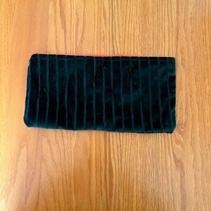 Cosmetic bag made with recycled vintage fabrics.